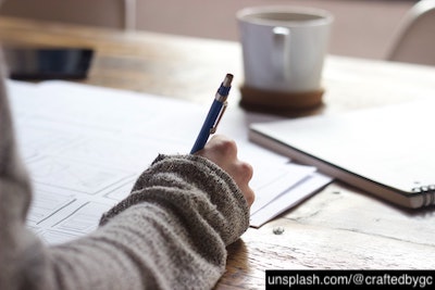 student taking notes
